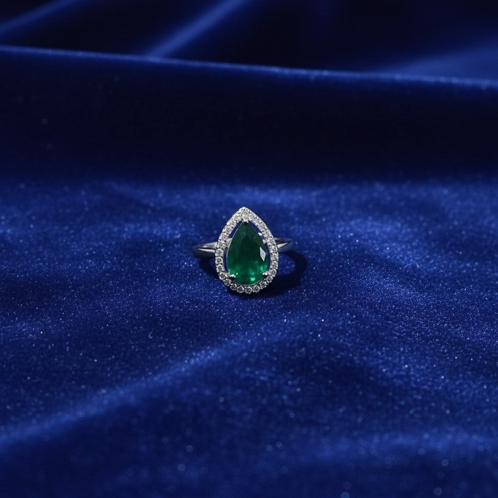 SilverStones.Pk designer ladies ring with a pear-cut green zircon stone surrounded by small clear zircon stones.