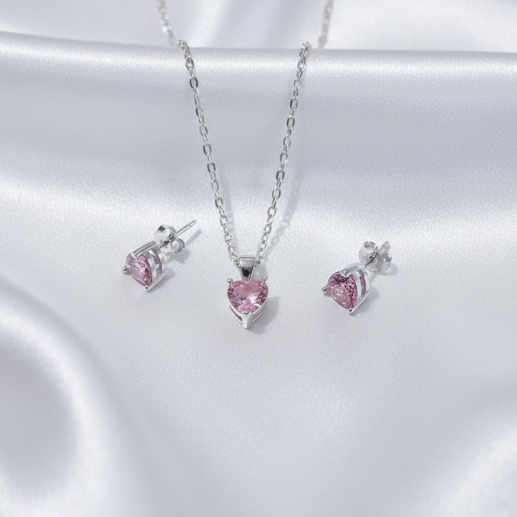 SilverStones.Pk Sterling silver necklace and earrings set with pink heart-shaped zircon stones.