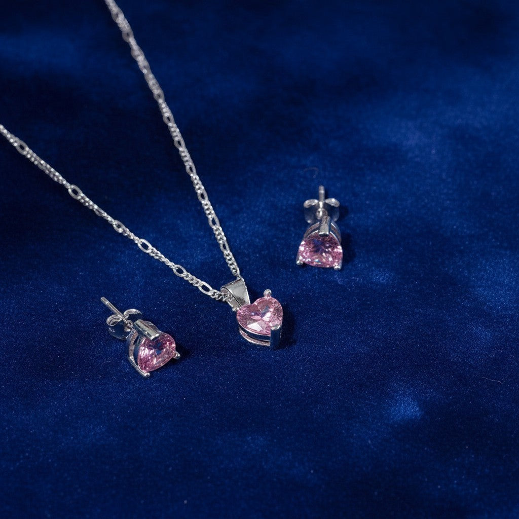 SilverStones.Pk Sterling silver pendant and earrings set with pink heart-shaped zircon stones.