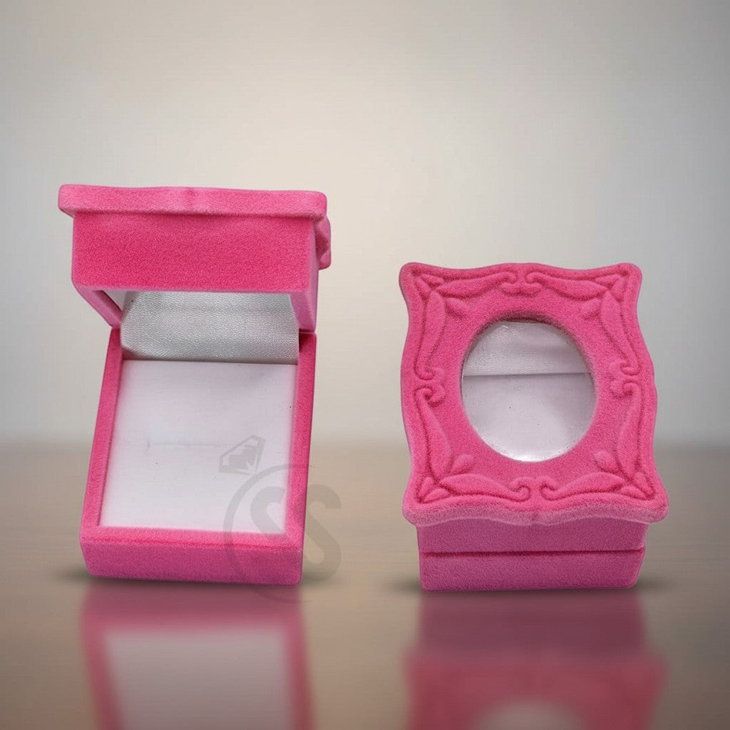 SilverStones.Pk pink velvet ring box with ornate frame and clear window, open and closed views.