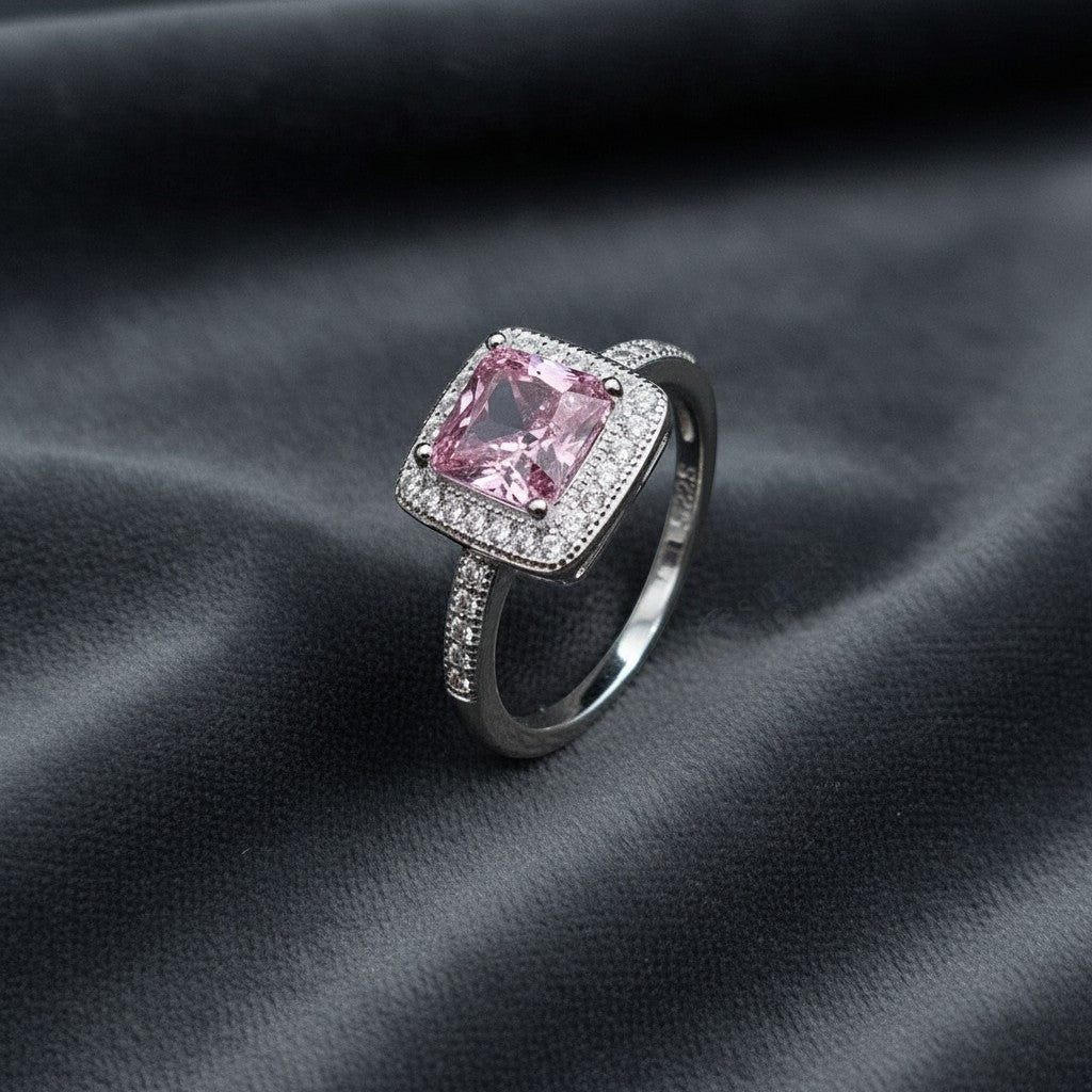 SilverStones.Pk pink square zircon halo ring in 925 Italian sterling silver. Features a central pink stone surrounded by smaller clear stones.