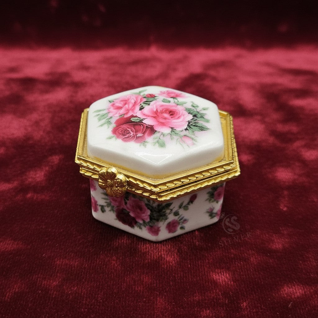 SilverStones.Pk ornate hexagonal porcelain jewelry box with pink roses and gold trim.