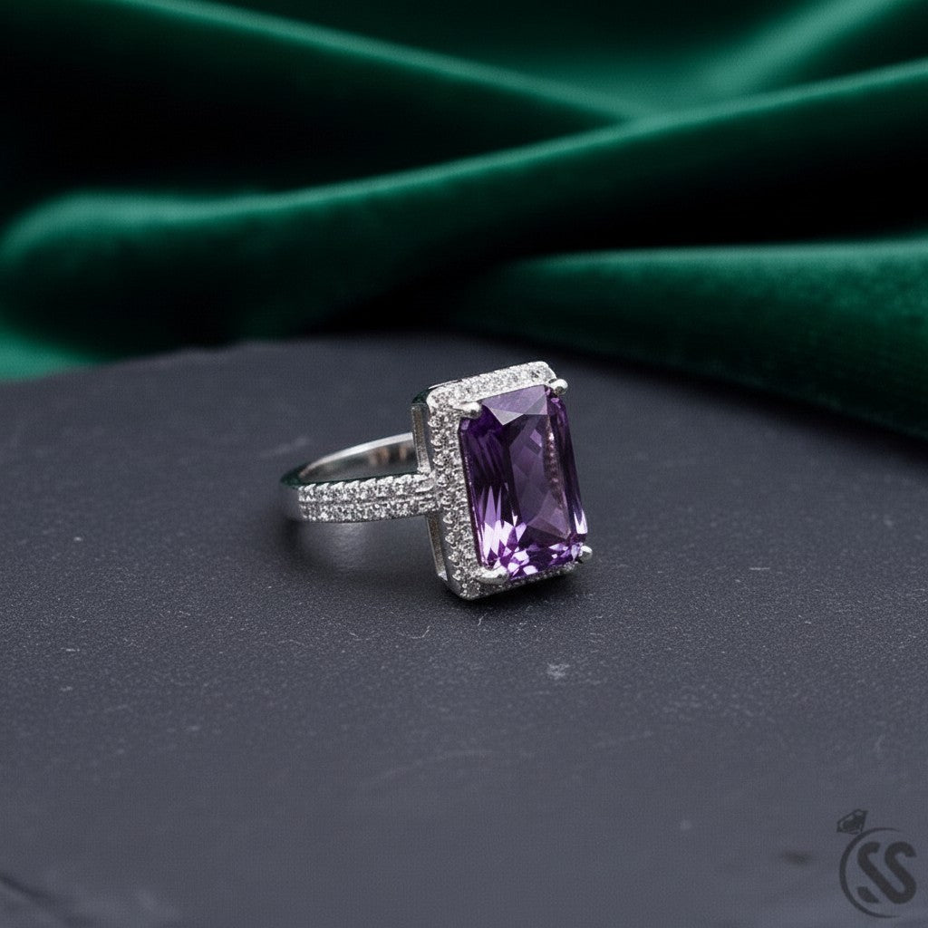 SilverStones.Pk 925 Italian silver ring with a large rectangular purple zircon stone surrounded by small clear zircon stones.