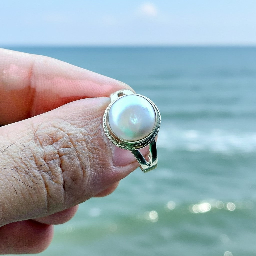 SilverStones.Pk handcrafted sterling silver ring with a real natural pearl center, featuring a twisted rope bezel and split band.