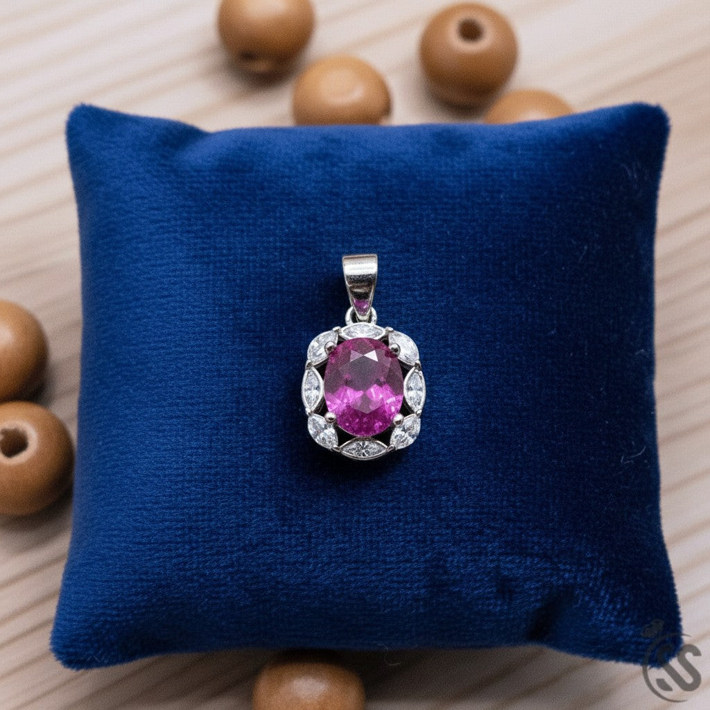 SilverStones.Pk oval real ruby pendant surrounded by clear cubic zirconia on rhodium-plated sterling silver.