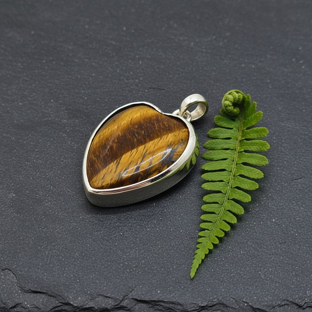 SilverStones.Pk Real Tiger stone pendant with a heart shape and golden-brown bands. Handmade silver jewelry.