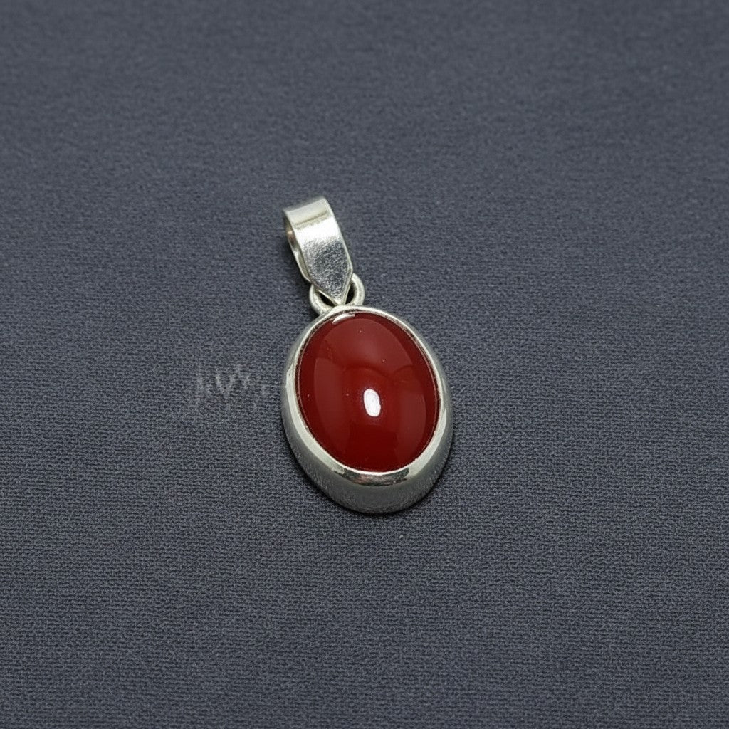 SilverStones.Pk oval red aqeeq gemstone pendant with a silver bail. Symbolizes strength and protection.
