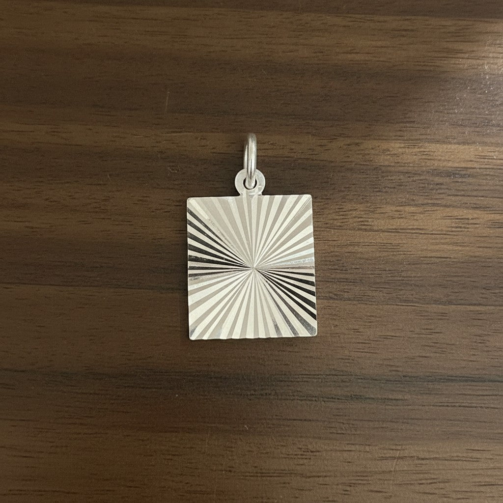SilverStones.Pk square pendant with radiating lines design, made of sterling silver.