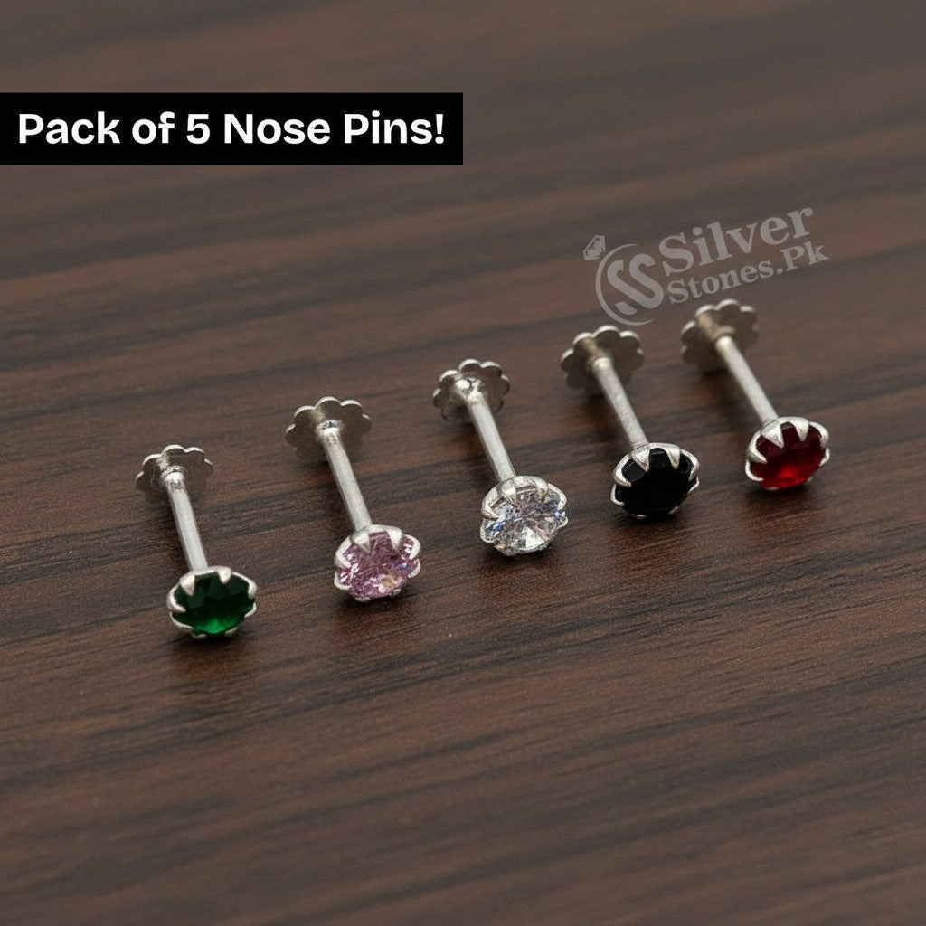 SilverStones.Pk pack of 5 silver nose pins with sparkling zircon stones in green, pink, clear, black, and red.