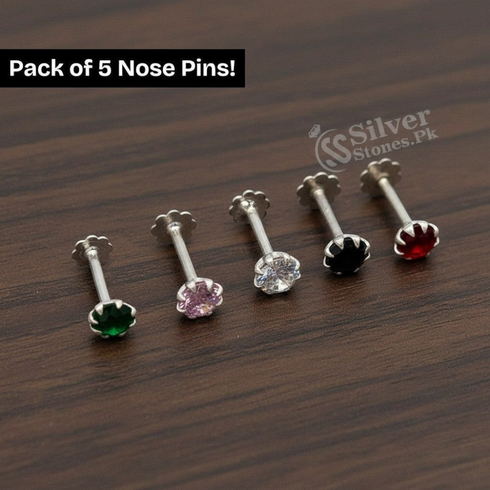 SilverStones.Pk pack of 5 silver nose pins with sparkling zircon stones in green, pink, clear, black, and red.
