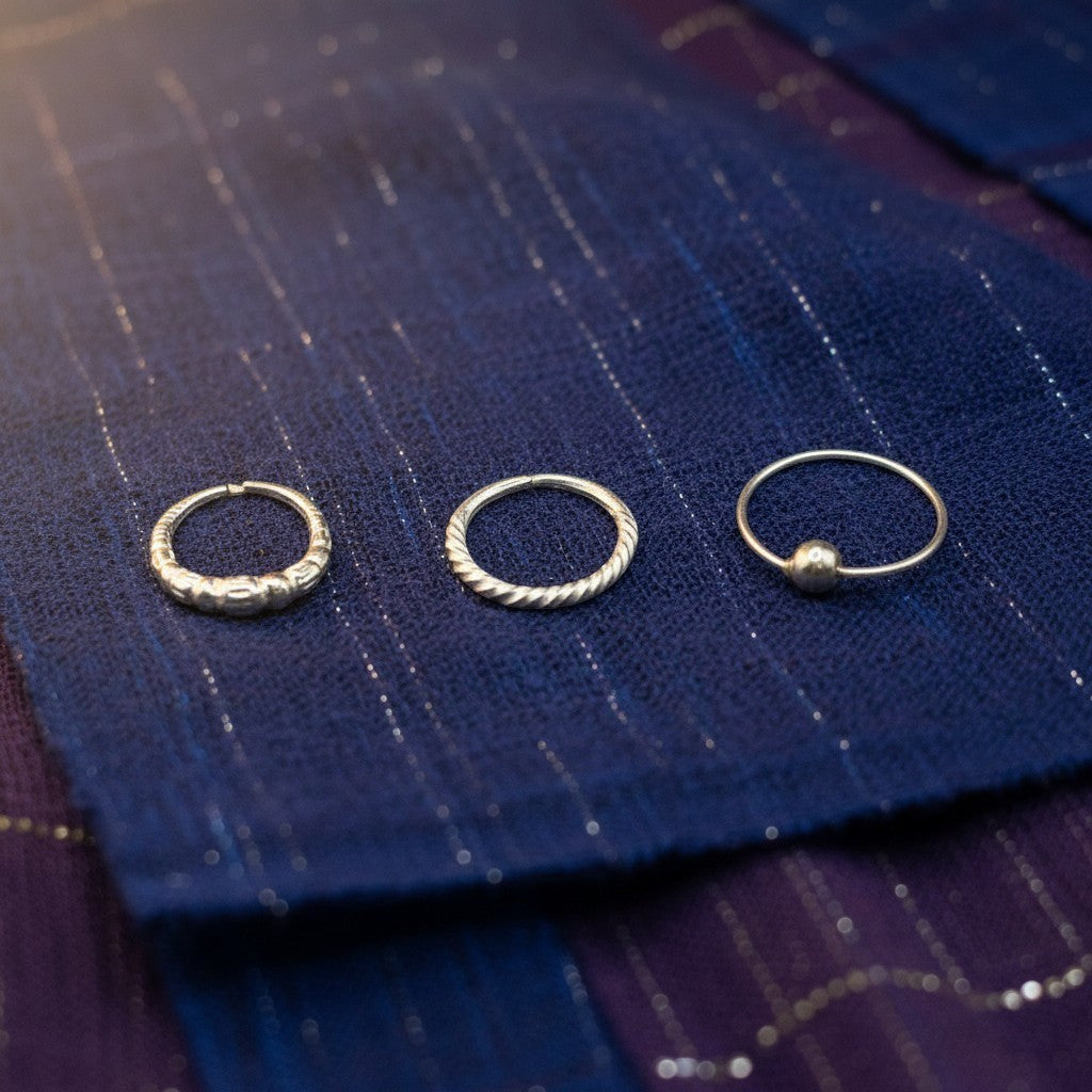 SilverStones.Pk pack of 3 silver nose rings with zircon, featuring twisted, beaded, and simple ball designs.