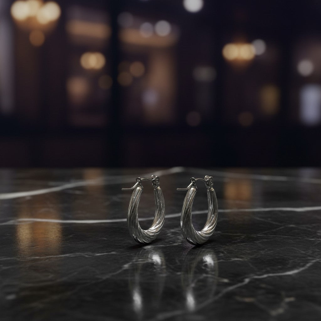 SilverStones.Pk elegant silver color oval hoop earrings with twisted texture, perfect for parties and daily wear.