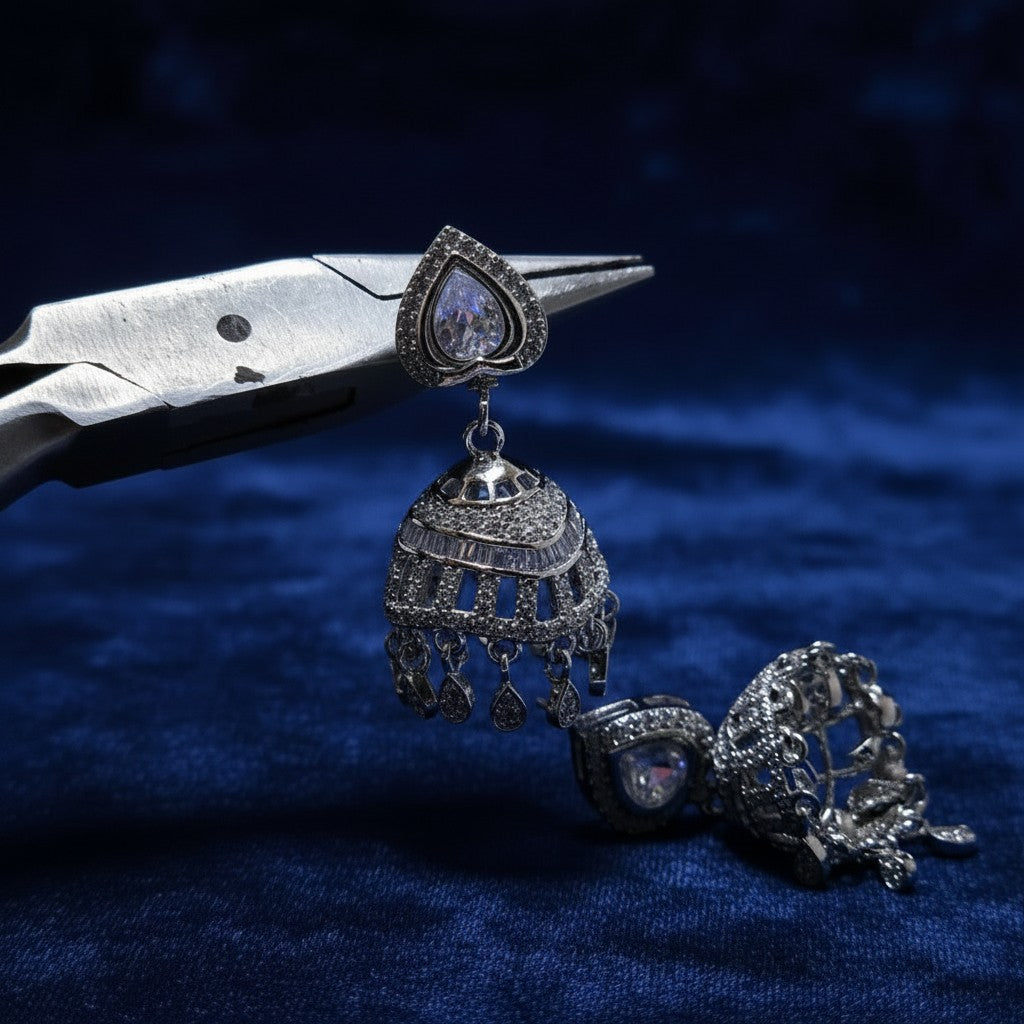 Silver color jhumka earrings with real zircons, detailed design, and long-lasting shine. SilverStones.Pk.