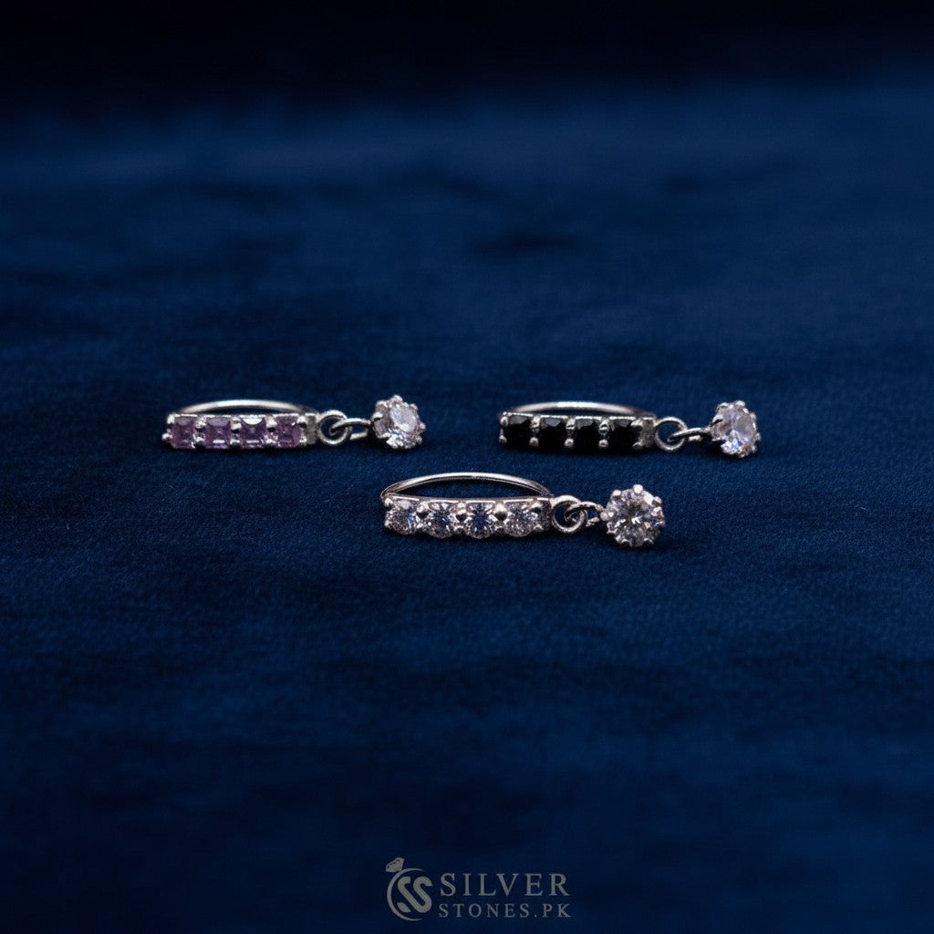 SilverStones.Pk silver nose ring with clear and purple zircon stones, 10mm hoop with dangling charm.