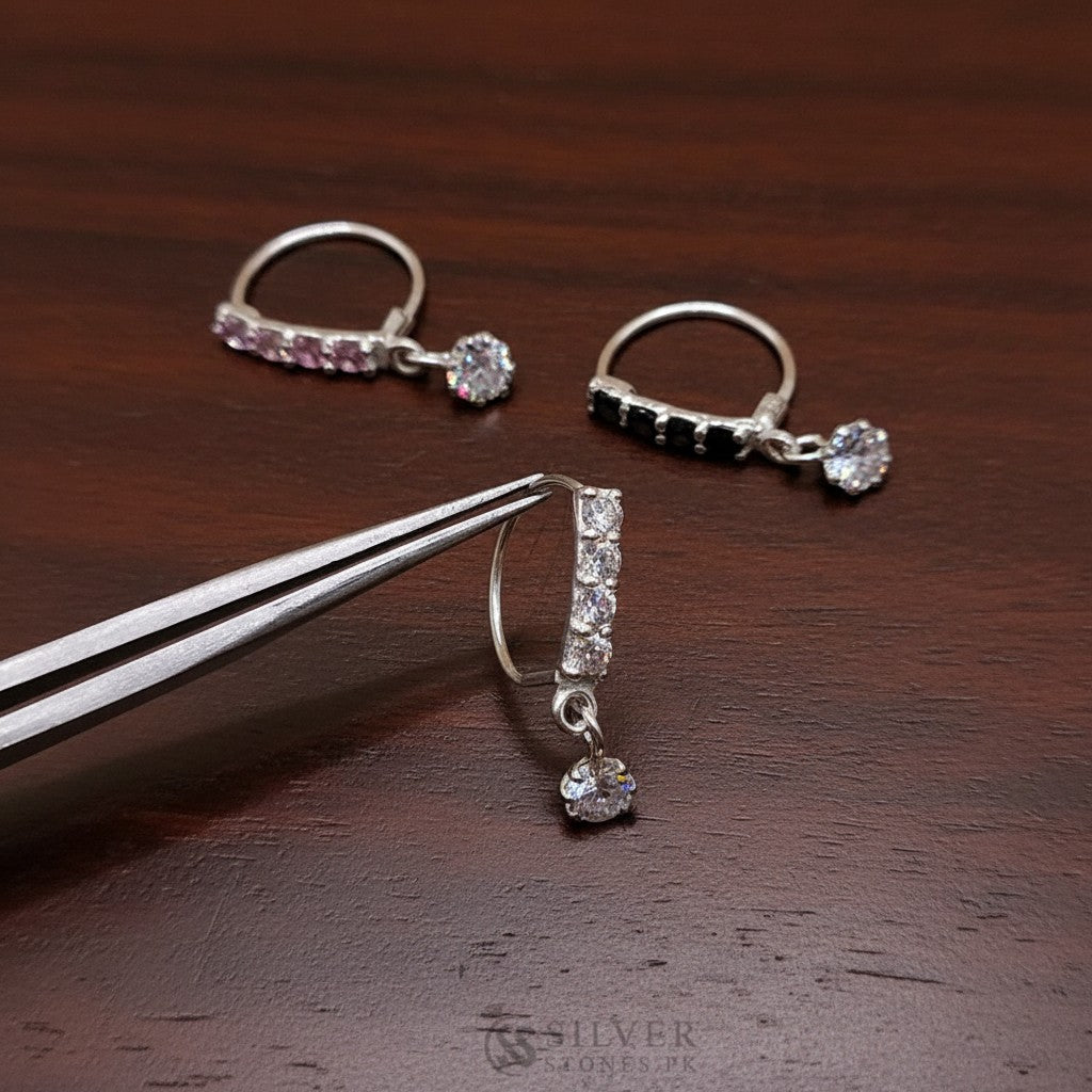 SilverStones.Pk silver nose ring with clear zircon drop and bar of clear stones.