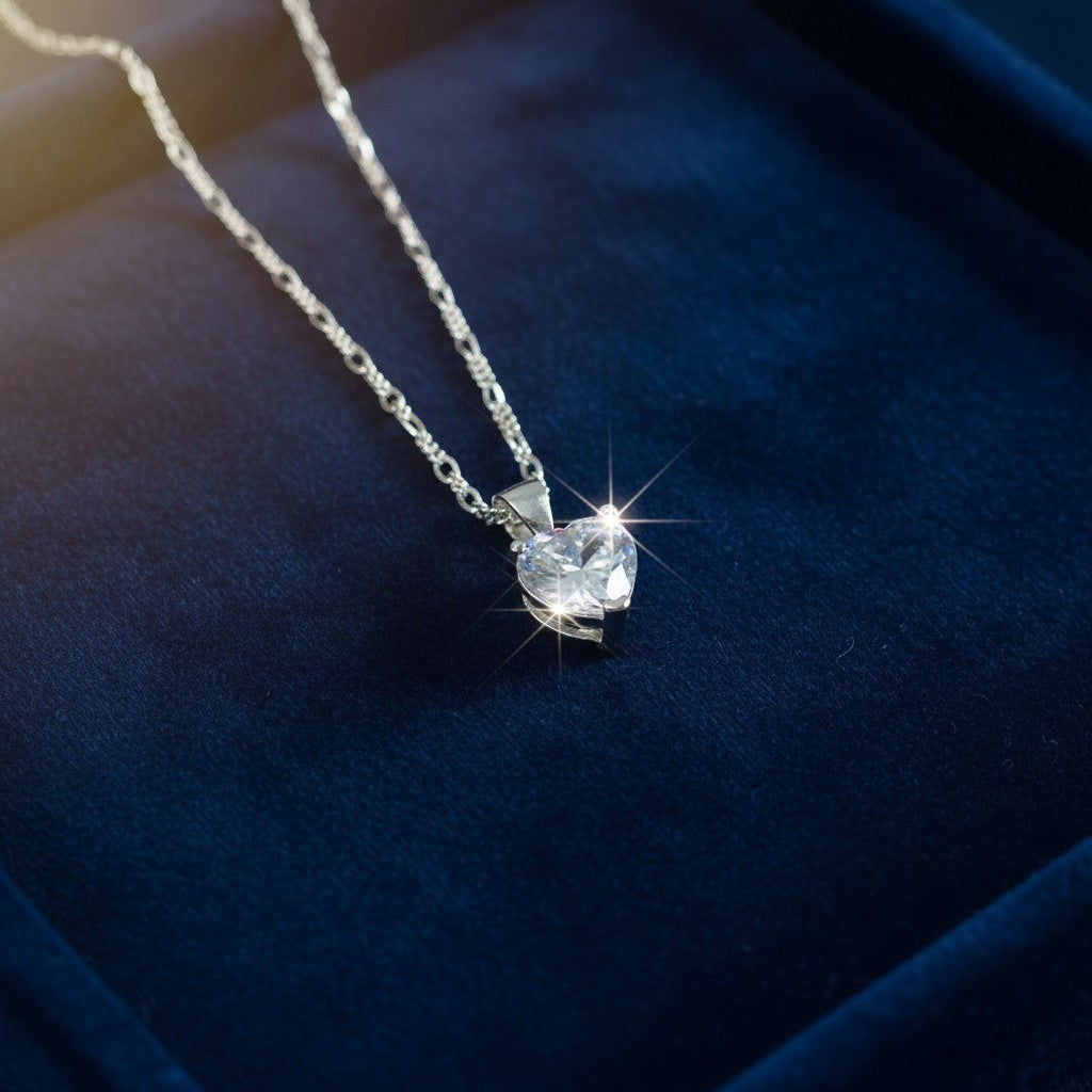 SilverStones.Pk sterling silver heart pendant necklace with a clear zircon and Figaro chain.
