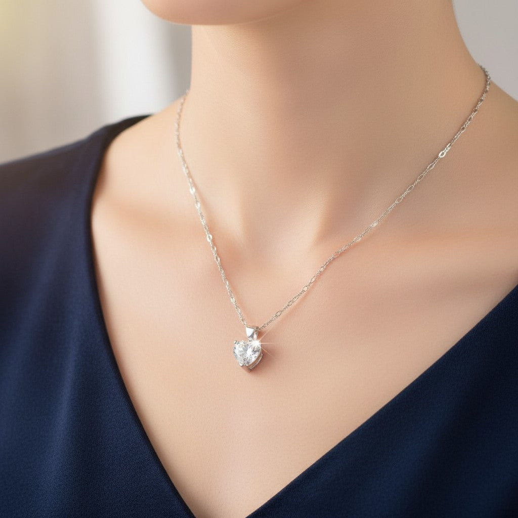 SilverStones.Pk sterling silver heart pendant with clear zircon on a Figaro chain.