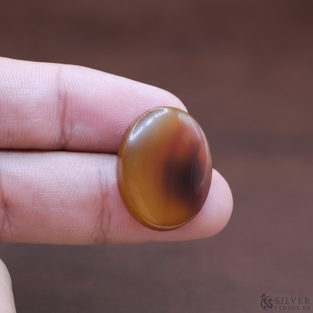 SilverStones.Pk oval Sulemani Aqeeq stone, natural brown and red banding, 5.20 grams, symbol of strength and protection.