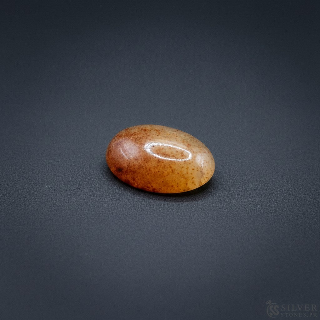 SilverStones.Pk real Sulemani Aqeeq stone, oval, translucent orange-brown with natural speckles, 4.40 grams.