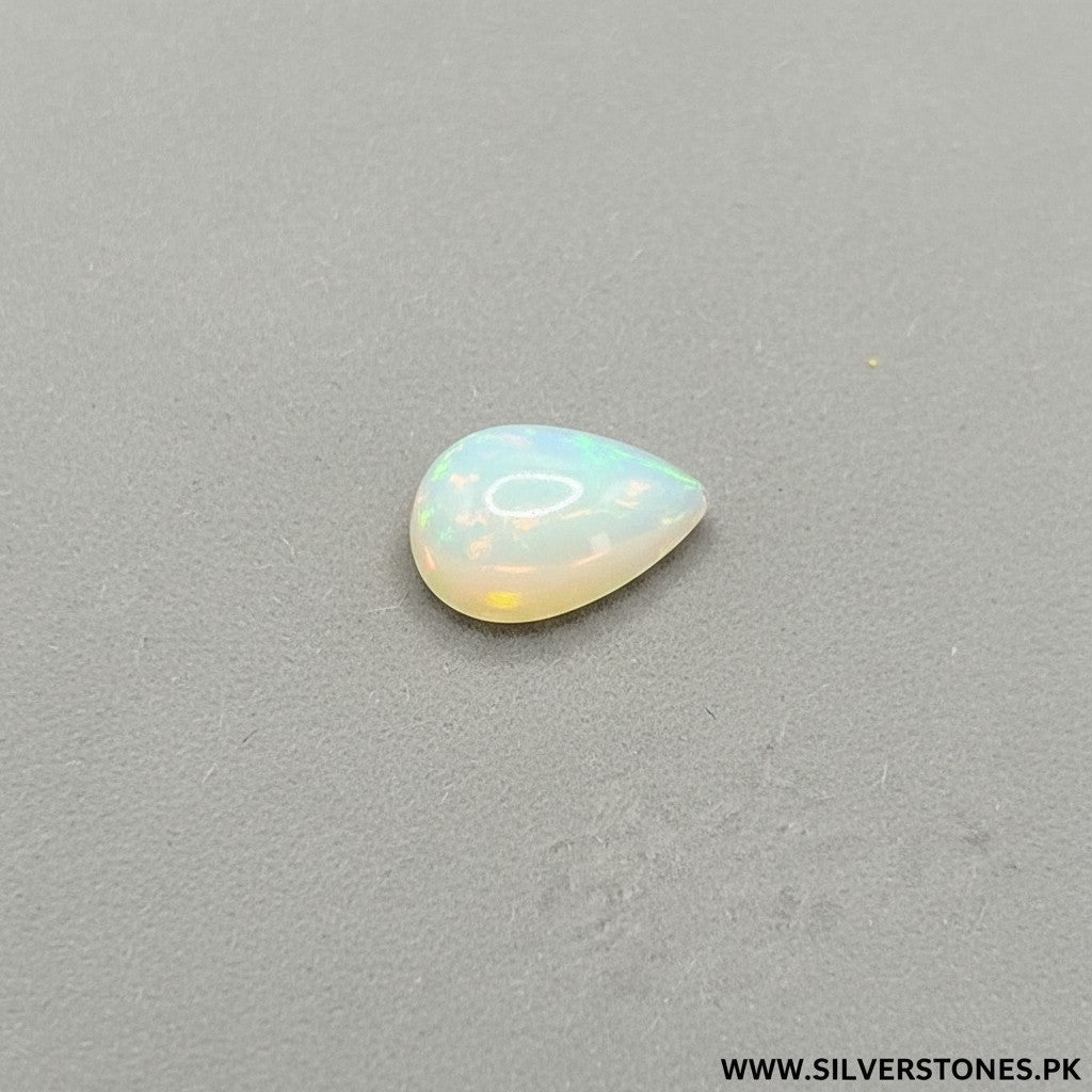 SilverStones.Pk white Ethiopian opal gemstone, pear shape, 4.75 carats, with iridescent play-of-color.
