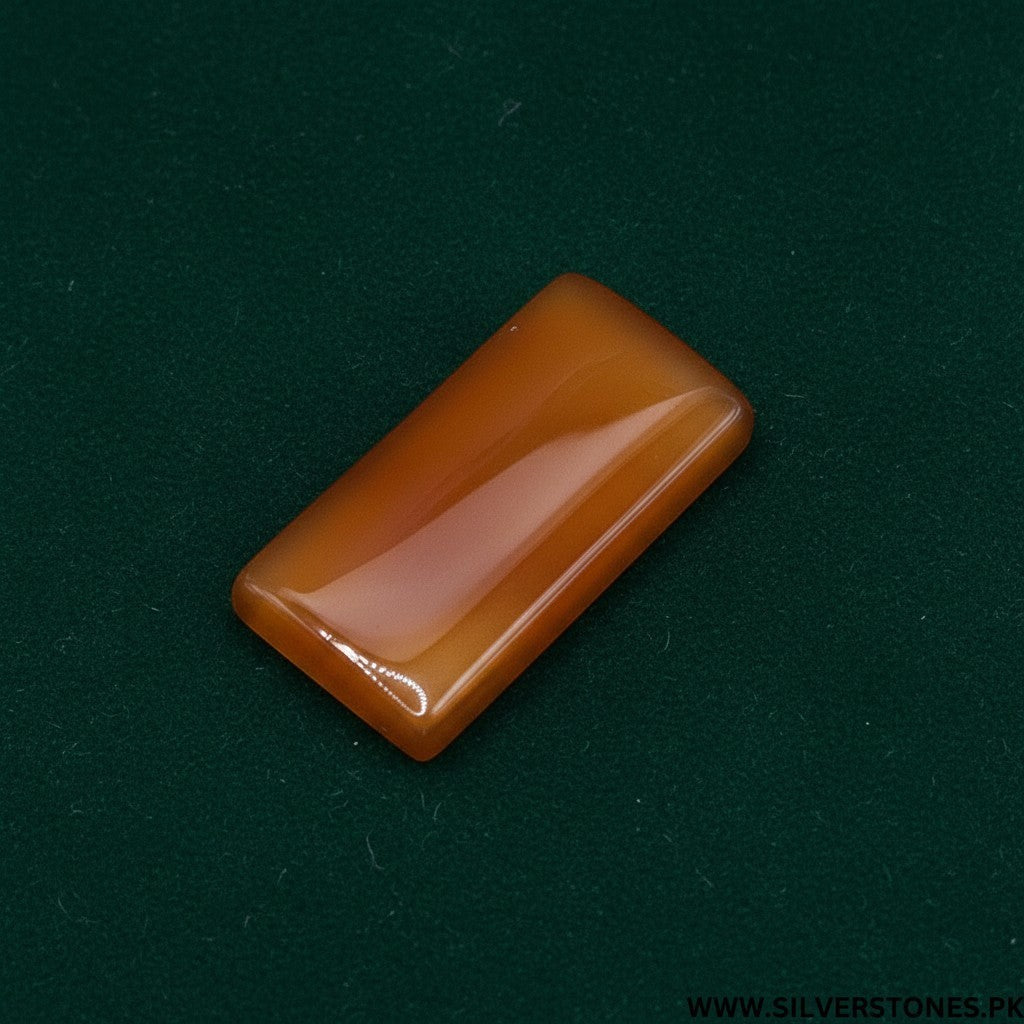 SilverStones.Pk rectangular polished orange-brown Yamni Aqeeq stone with smooth edges, ideal for jewelry.