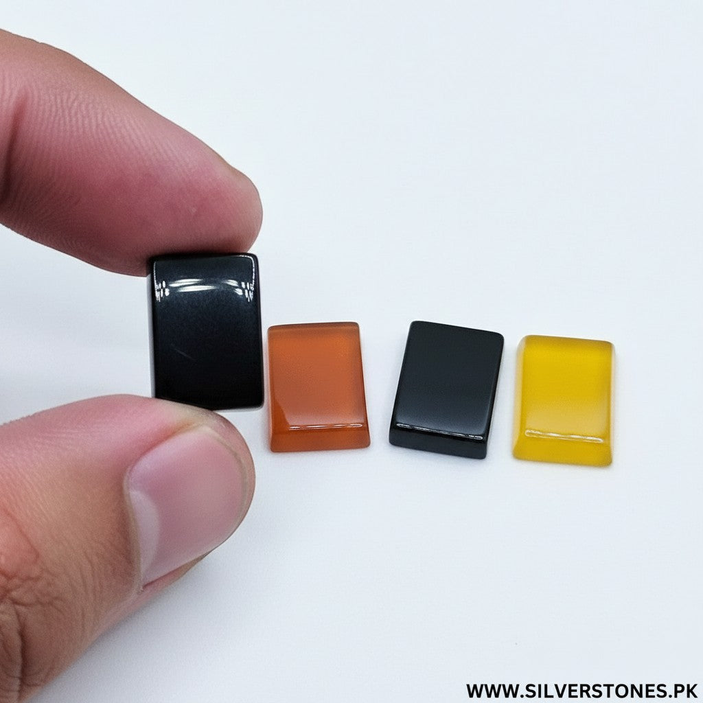 SilverStones.Pk real Yamni Aqeeq stones in black, orange, and yellow rectangular cabochons.