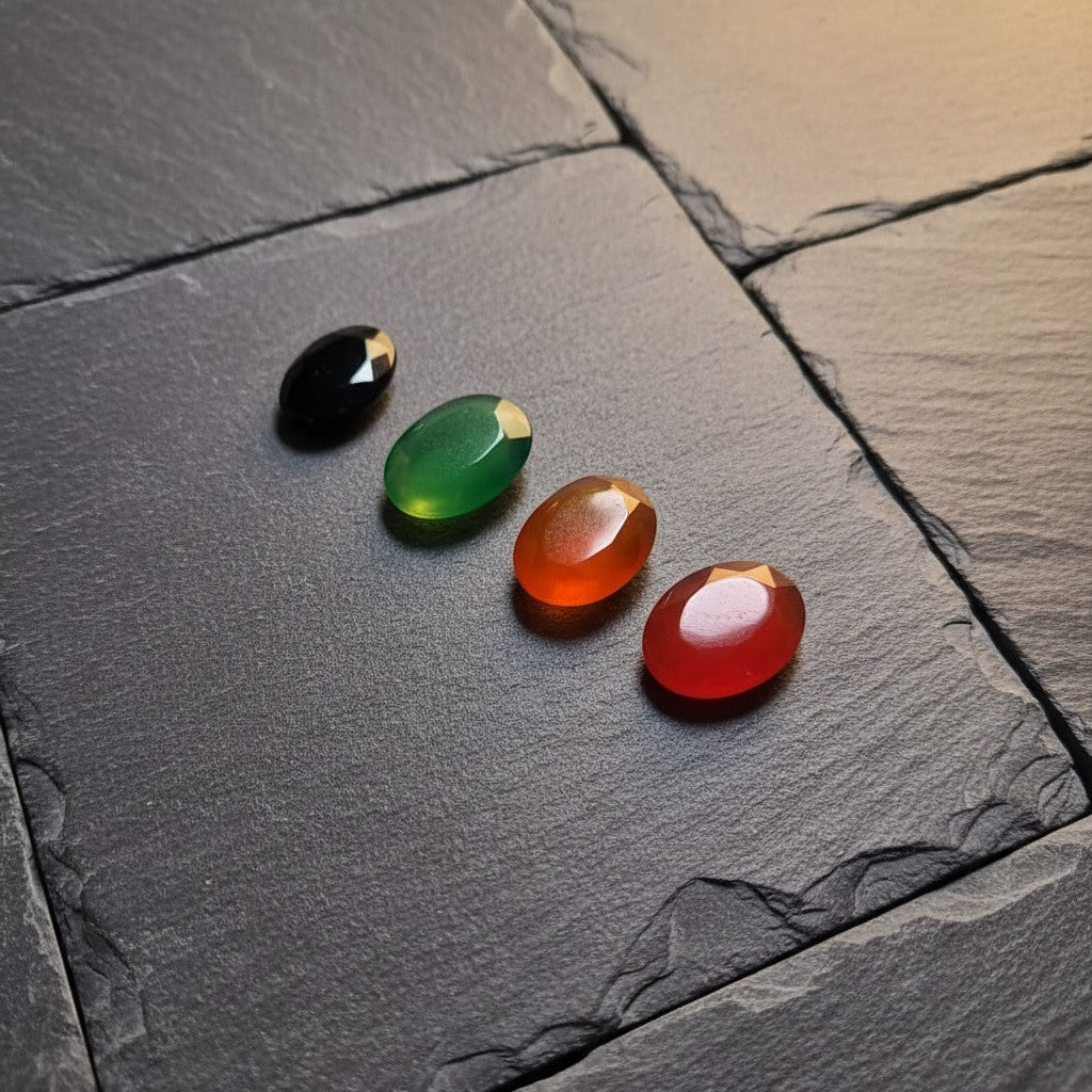 SilverStones.Pk Real Yamni Aqeeq stones in black, green, orange, and red oval cabochon cuts.
