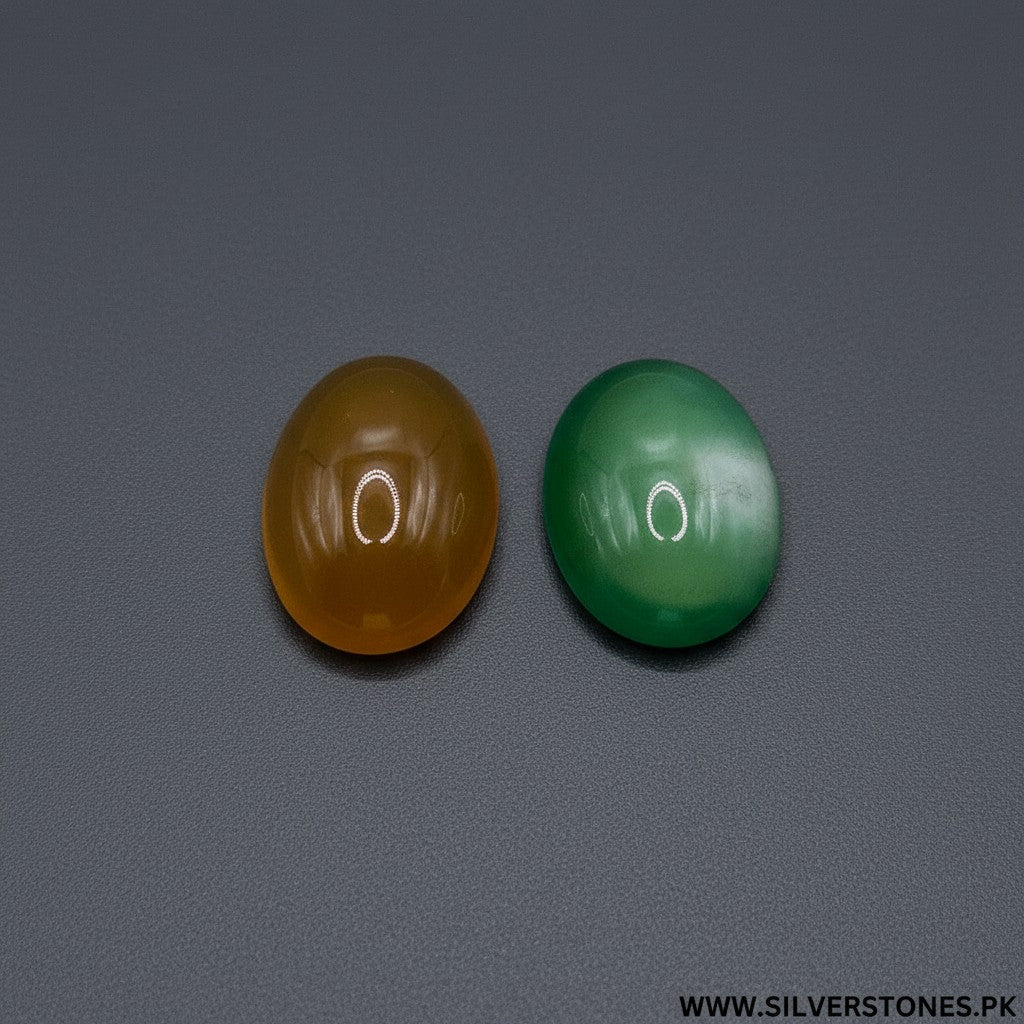 SilverStones.Pk oval Yamni Aqeeq stones in yellow and green, showcasing natural banding and smooth polish.